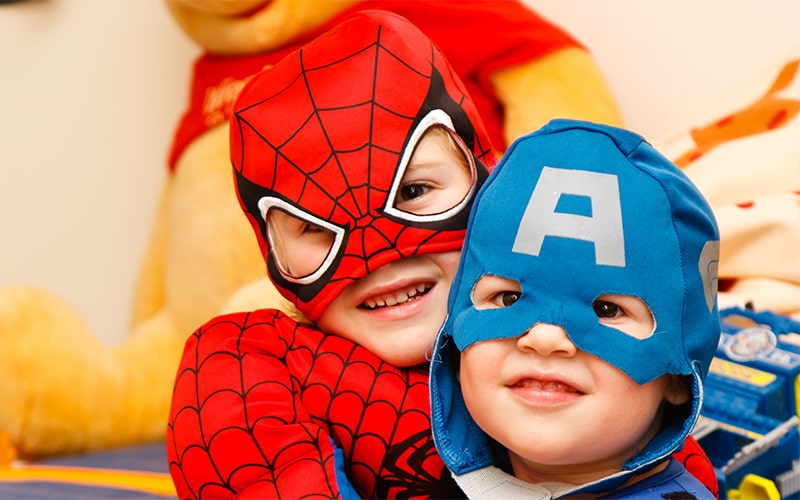 A child happily playing with colorful blocks